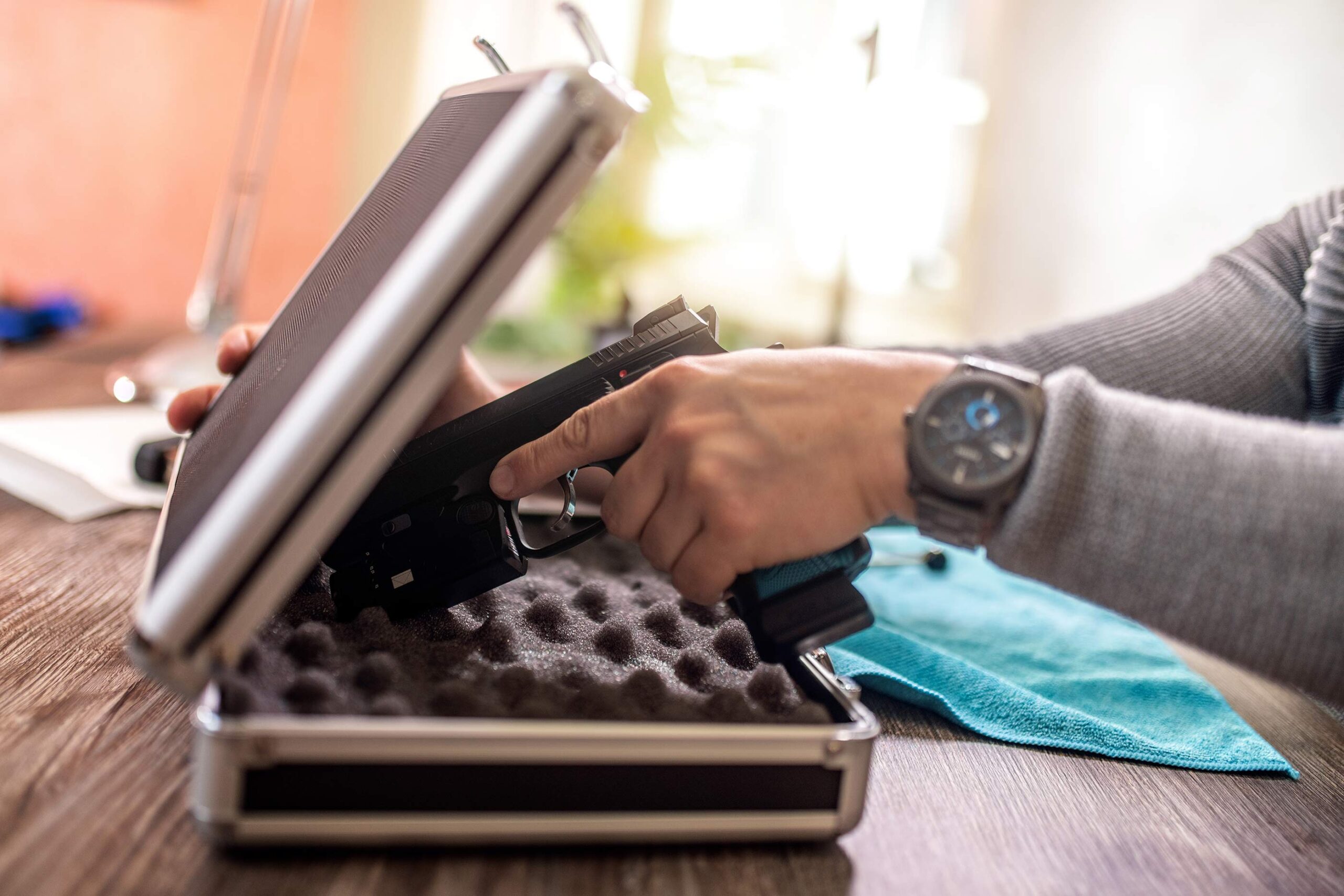 Person placing a gun in storage